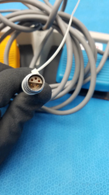 Gray coiled cable with metallic circular connector and five gold pins for arthrocare 10863 dual footswitch pedal used medical equipment for sale