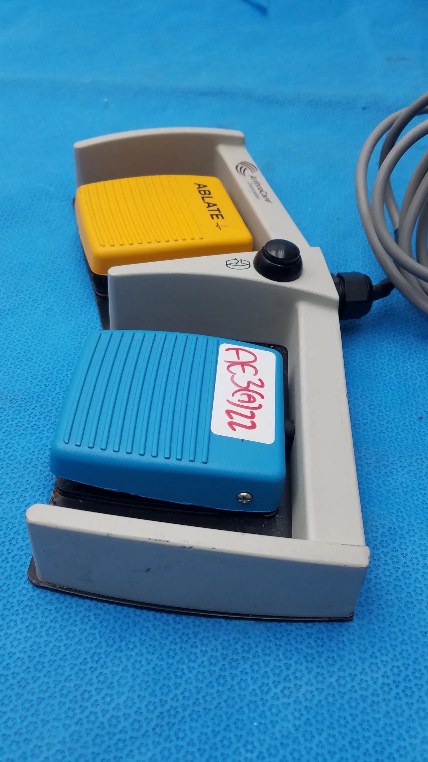 ArthroCare 10863 dual footswitch pedal gray plastic with yellow brake button and blue grip pedal for pre owned medical equipment sale