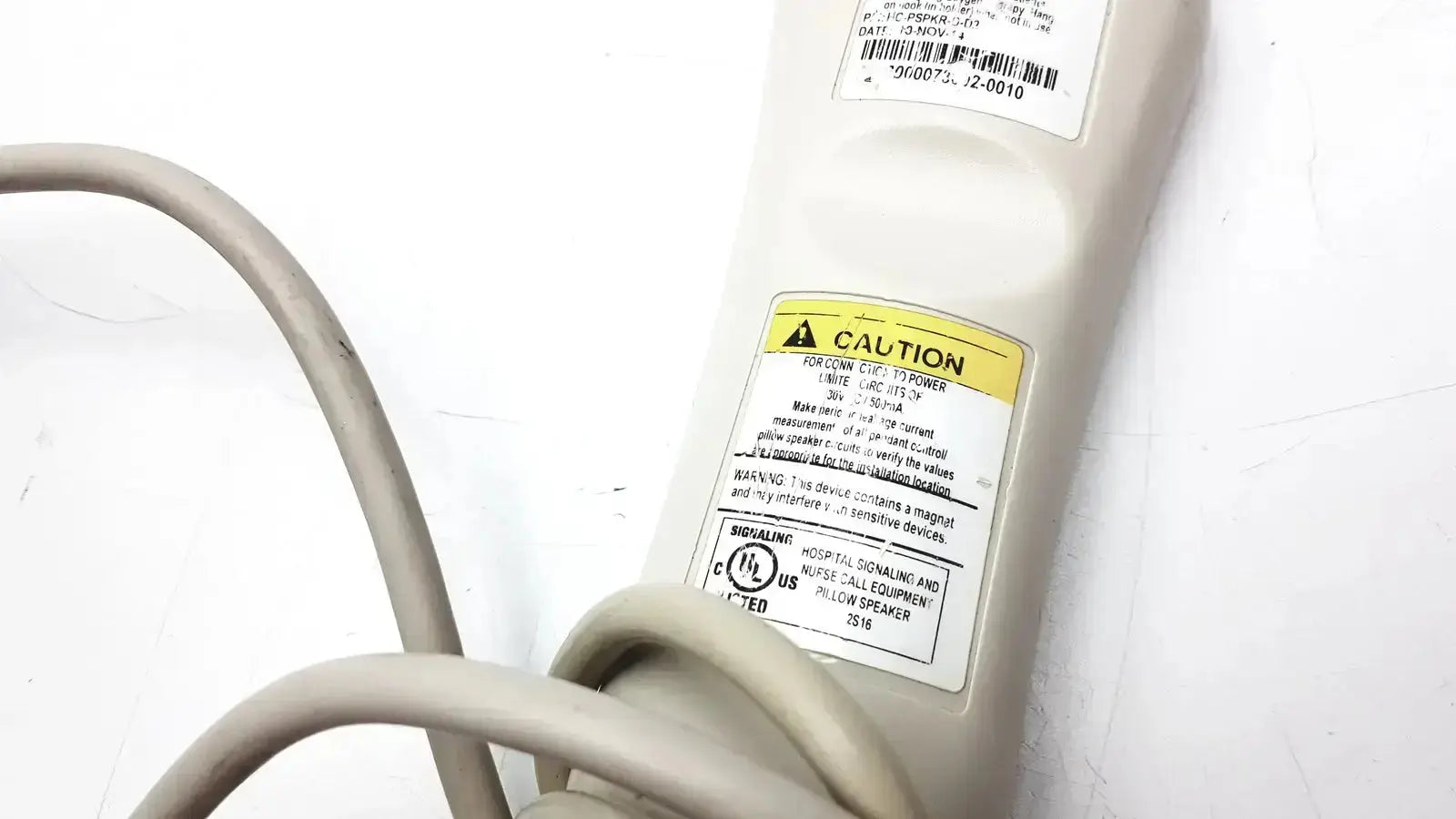 Beige plastic power strip with multiple outlets and coiled gray cord for hc-pspkr-da-d2 patient response system g-cir-r6-21c