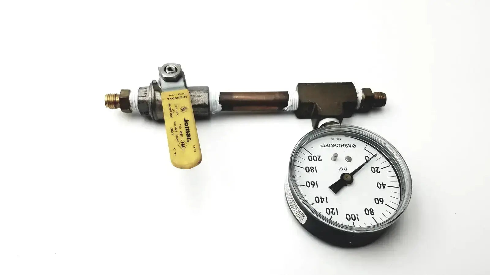 Black and silver Ashcroft dual-scale pressure gauge with yellow-handled valve on copper pipe for pre owned medical equipment sale