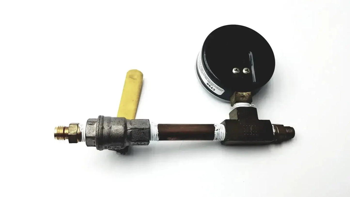 Black ashcroft dual-scale pressure gauge 0 to 200 psi and 0 to 1400 kpa mounted on metallic pipe with brass fittings and yellow handle for pre owned medical equipment sale