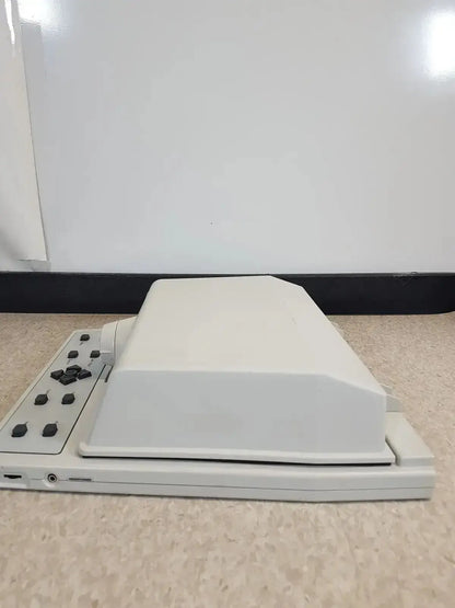 Off-white plastic audioscan verifit vf-1 hearing aid analyzer with rectangular lid and black control buttons on left side