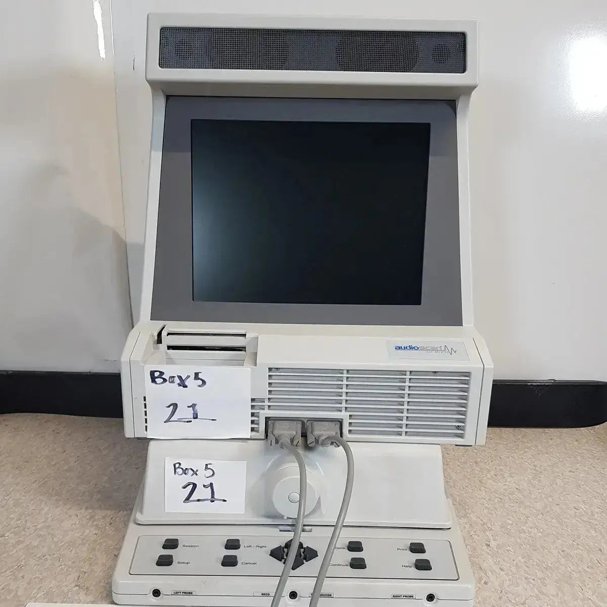 White plastic audioscan verifit vf-1 hearing aid analyzer with black screen speaker grille and control panel below