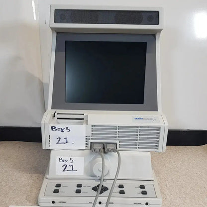 White plastic audioscan verifit vf-1 hearing aid analyzer with black screen speaker grille and control panel below