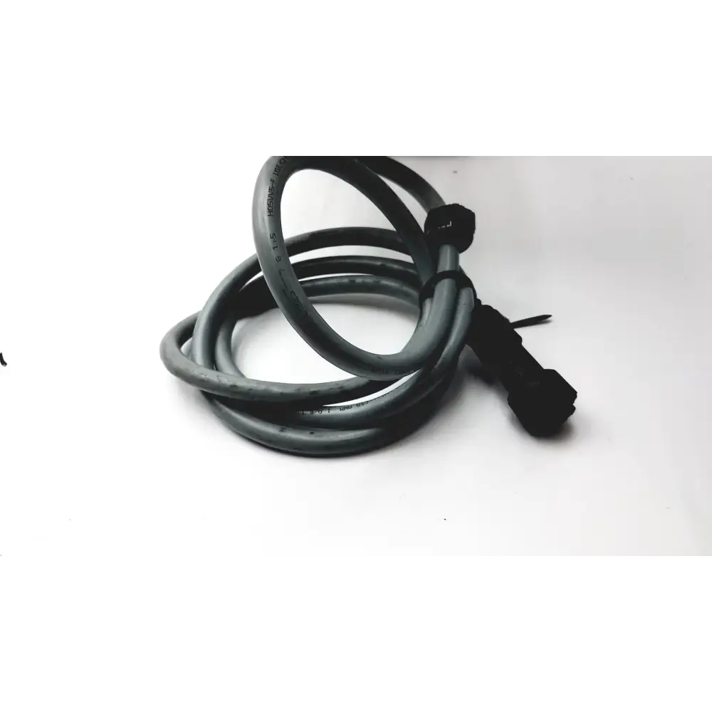 Black coiled cable with a black connector end