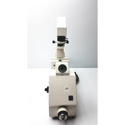 White, sturdy metal microscope with black adjustment knobs and a circular stage.