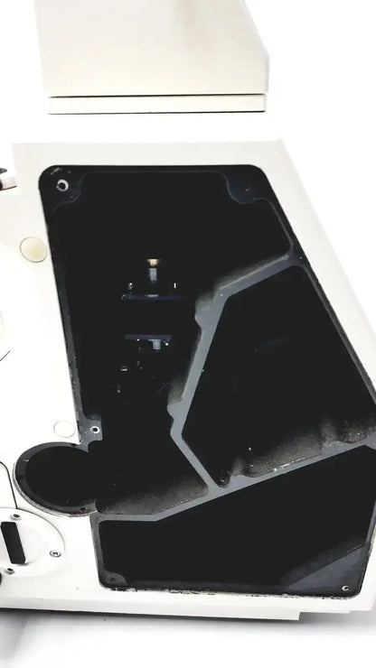 White plastic microscope stage with black interior compartments on axiovert 35 inverted phase contrast microscope