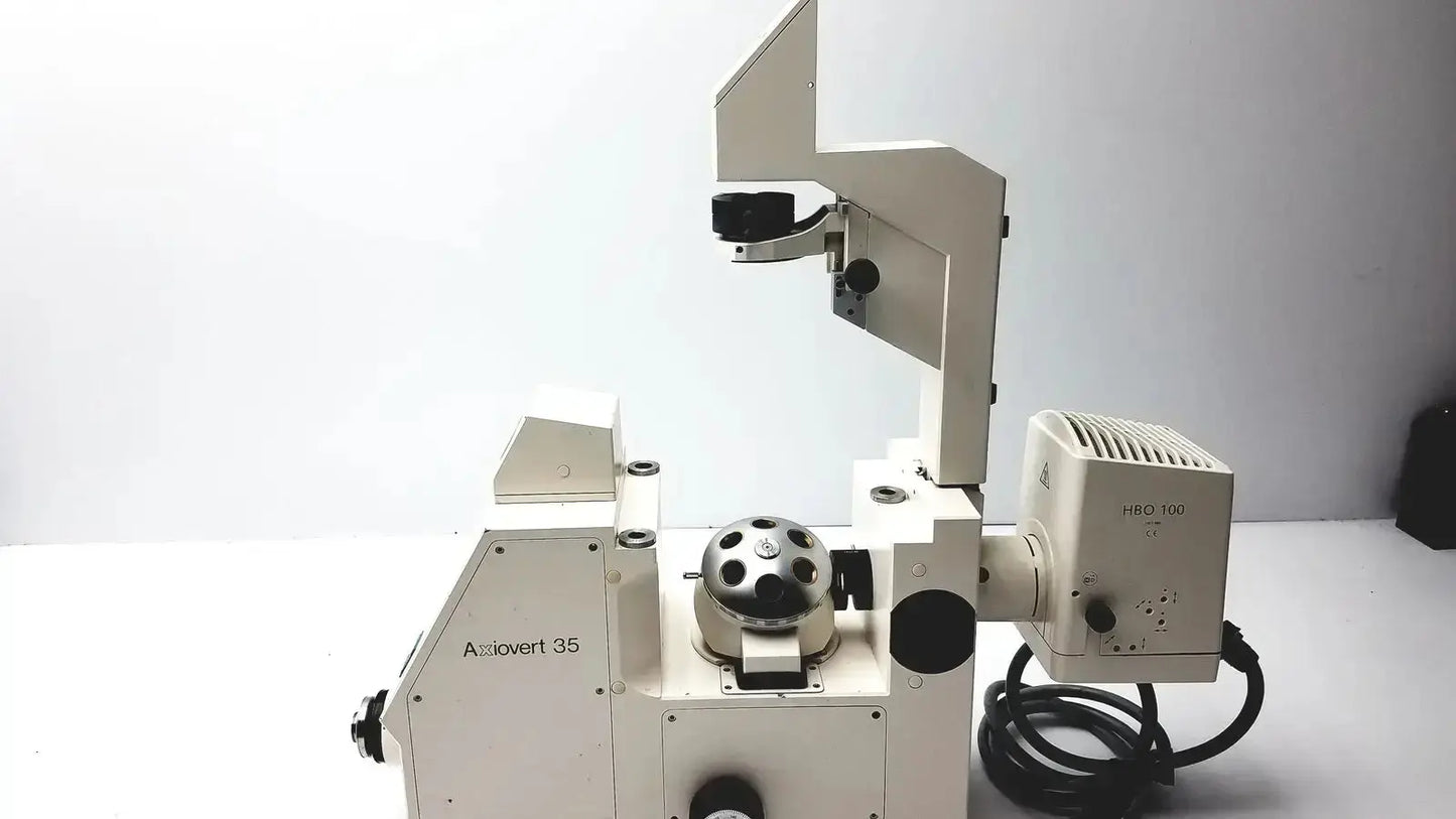 White metal axiovert 35 inverted phase contrast microscope with black circular stage for advanced contrast microscopy