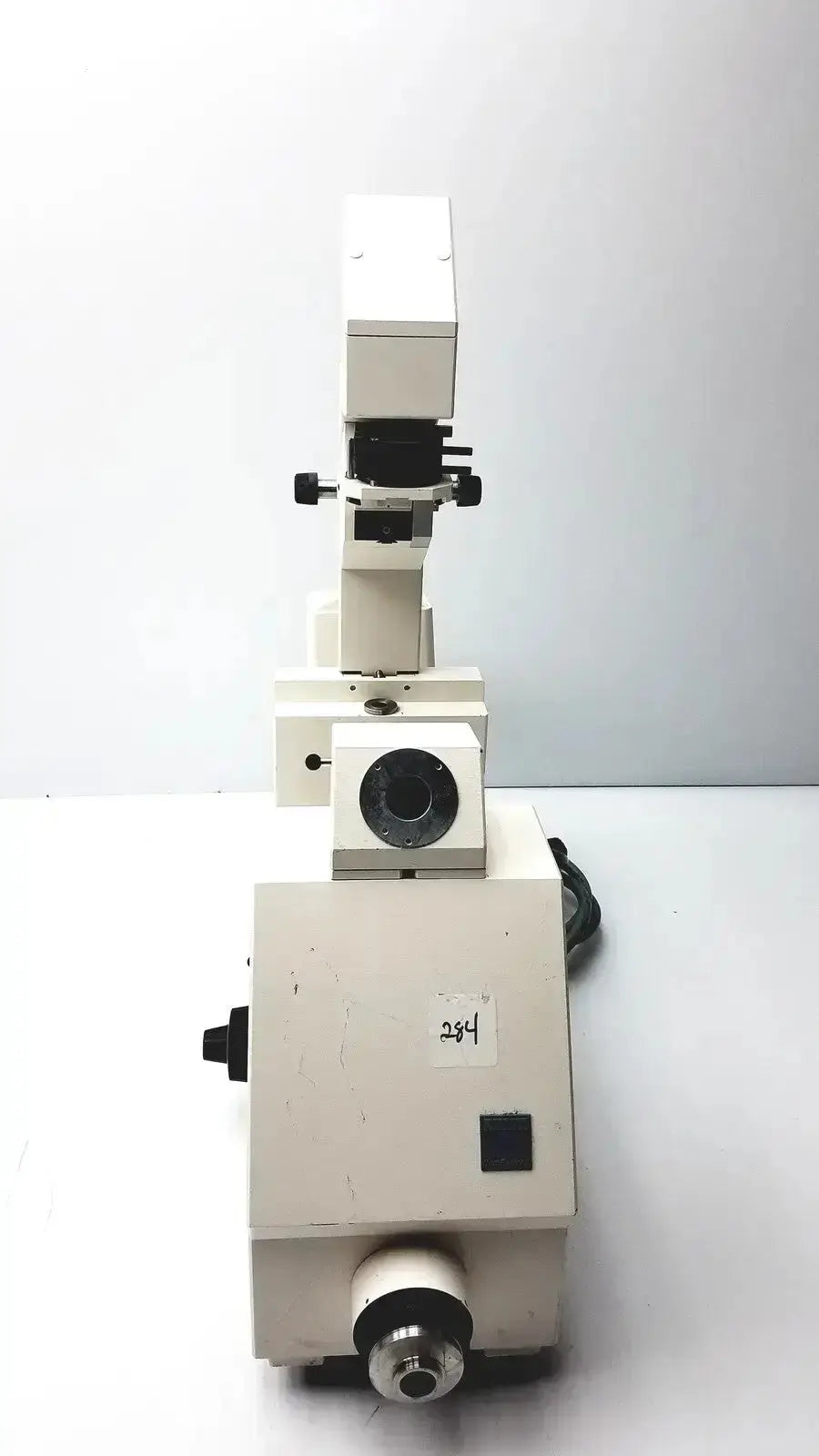 Axiovert 35 inverted phase contrast microscope with white body black adjustment knobs and circular stage aperture