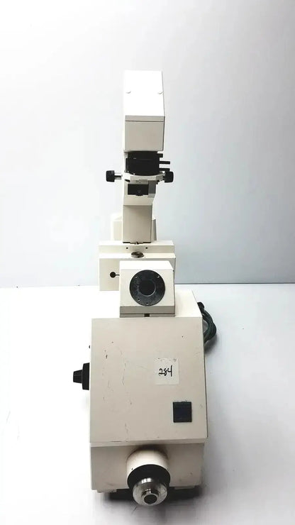 Axiovert 35 inverted phase contrast microscope with white body black adjustment knobs and circular stage aperture