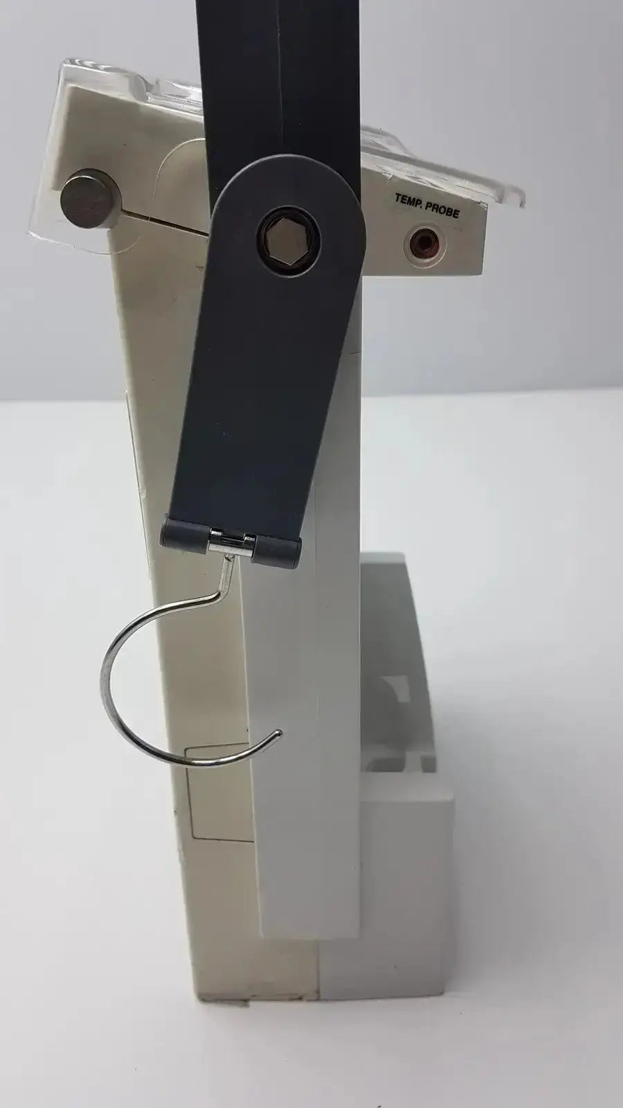 Gray plastic temperature probe holder with black strap and metal hook for bard criticore fluid output temperature monitor 000002n