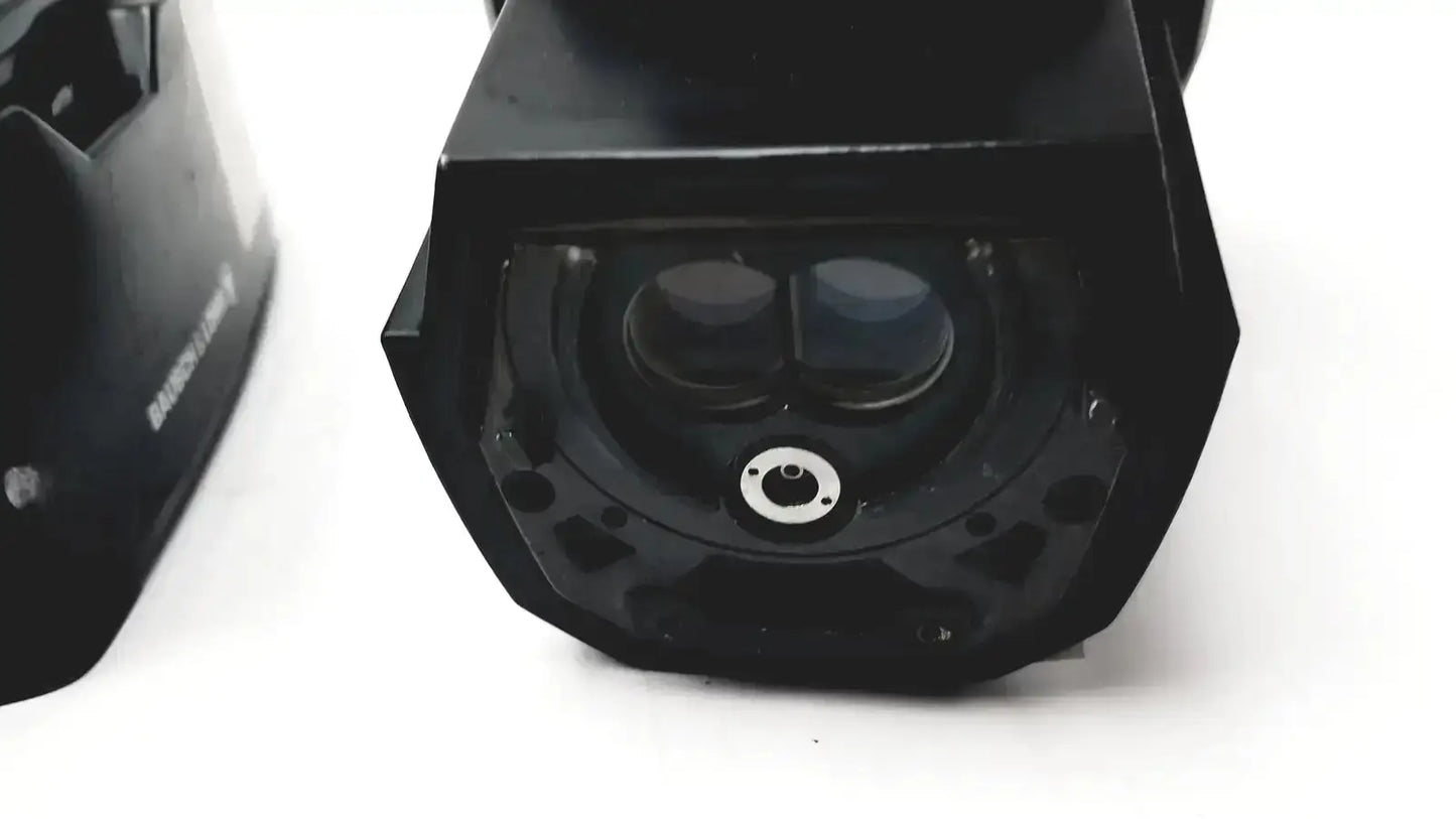 Black cylindrical security camera with dual lenses and central mounting hole for lomb microscope biomedical evaluation hospital surplus