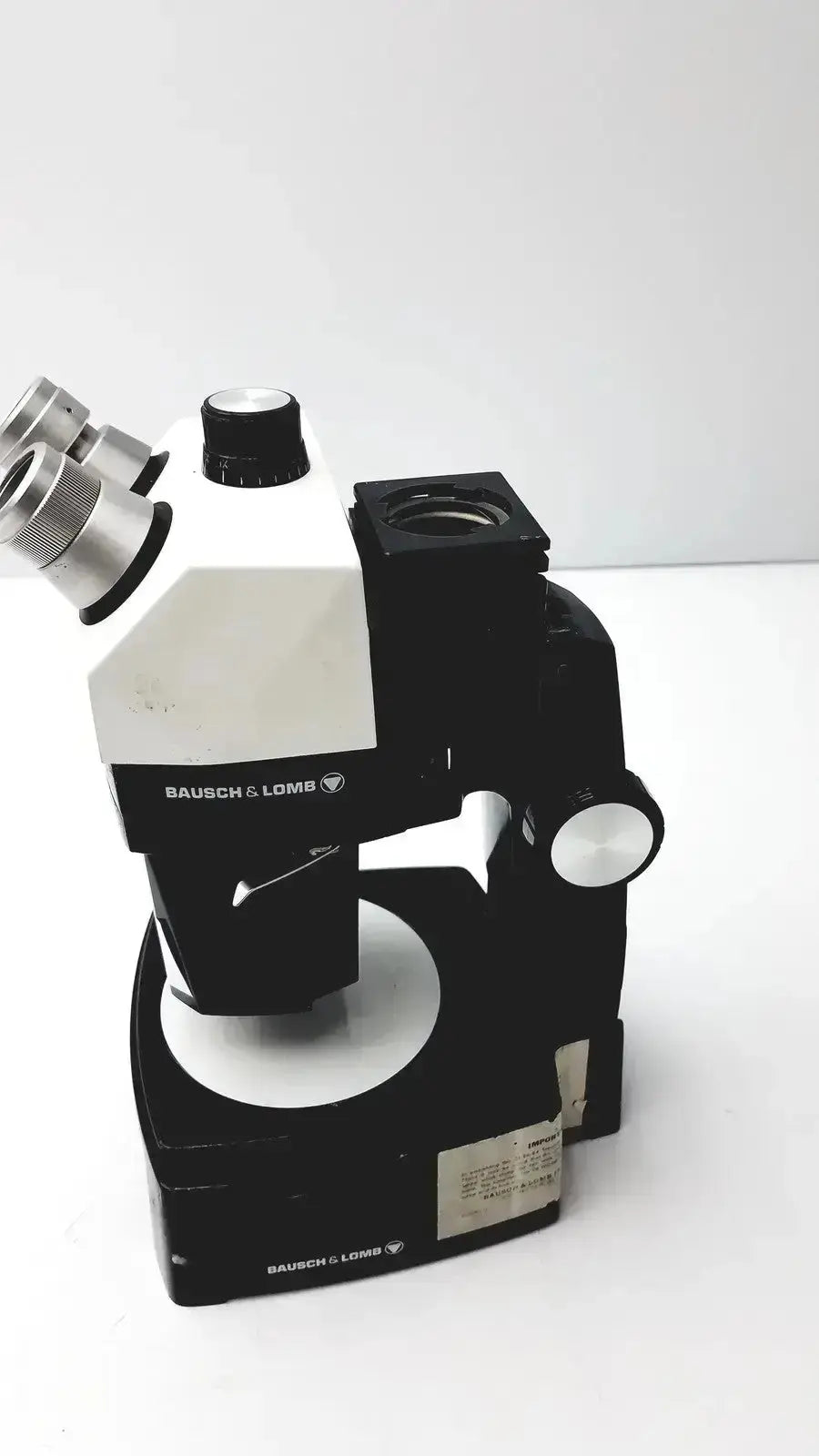 Black and white bausch and lomb microscope with silver eyepieces for biomedical evaluation hospital surplus untested