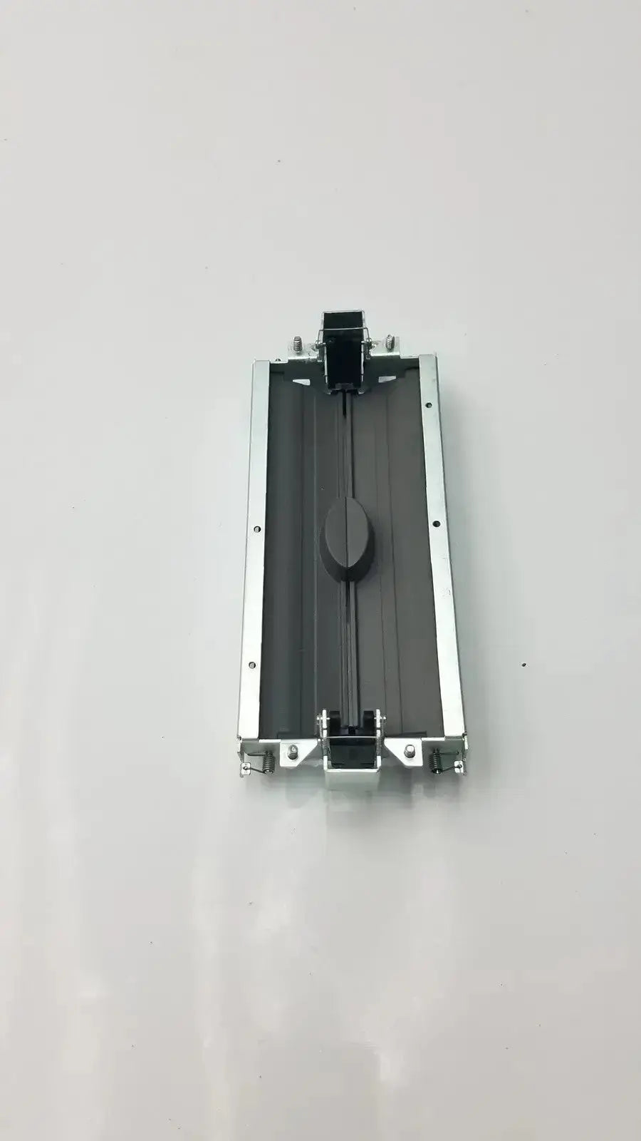 Silver aluminum-framed bazel and assy secondary barrier printer cartridge holder with black interior and central knob by siemens