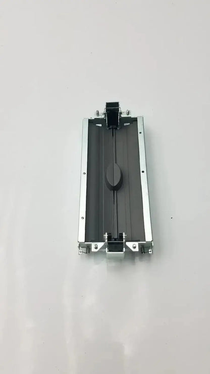 Silver aluminum-framed bazel and assy secondary barrier printer cartridge holder with black interior and central knob by siemens