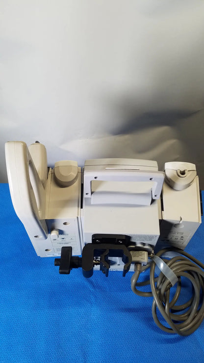 White medical-grade tape dispenser with beige accents and black clamps for modular infusion in bd alaris 8015 pc pump medical equipment