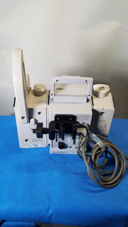 Bd alaris 8015 pc pump with 2x 8100 modules white medical equipment with beige accents and coiled gray cable for modular infusion