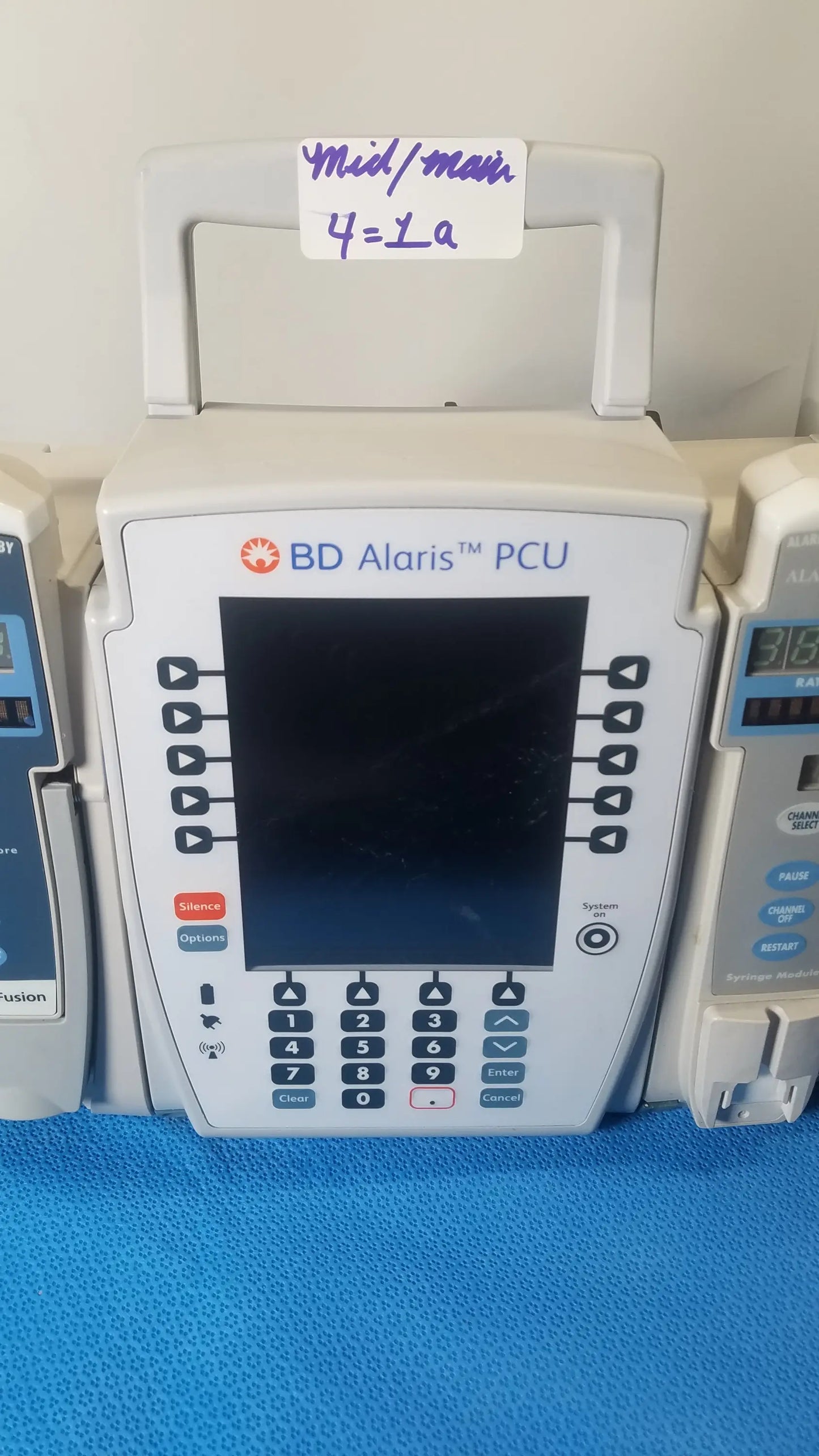 White bd alaris pcu infusion pump with digital screen and control buttons for modular infusion medical equipment reuse