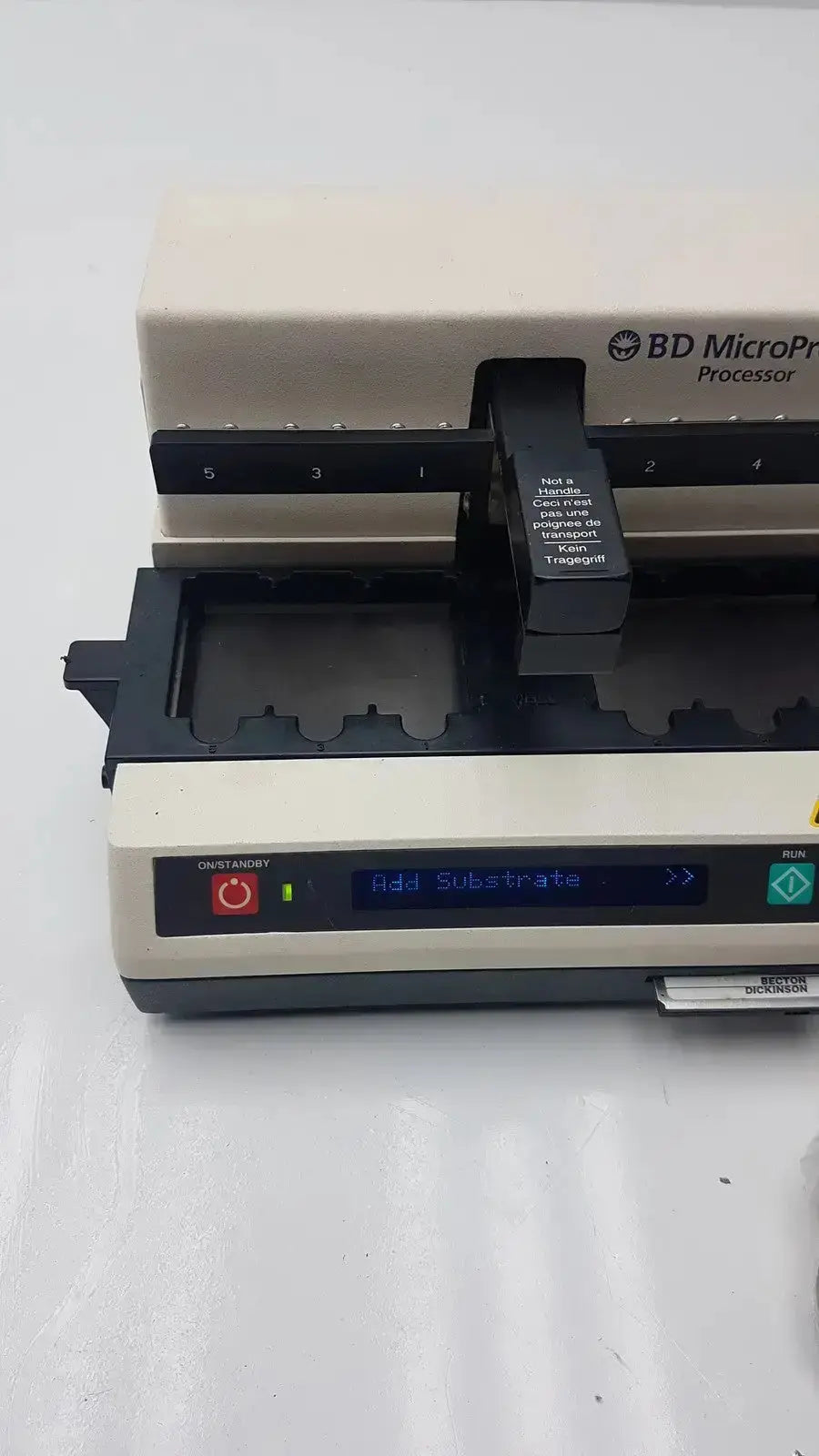 Beige and black BD MicroProbe processor with digital display and labeled slots for processing pre owned medical equipment sale