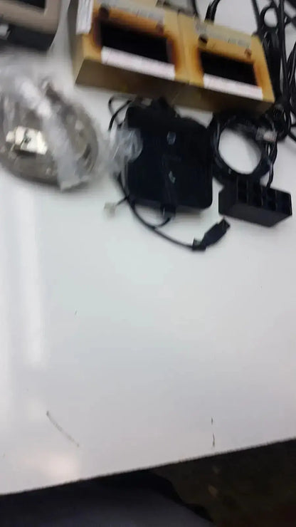 Black plastic charging dock with two slots and cables for bd microprobe processor buy used medical equipment