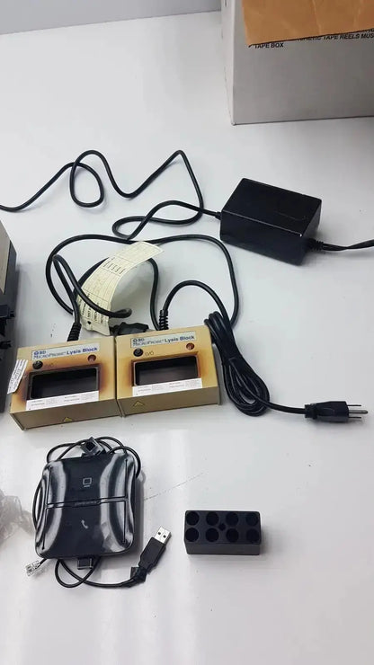 Black rectangular microprobe processor power adapter with coiled cable and plug for alysis block hospital surplus use