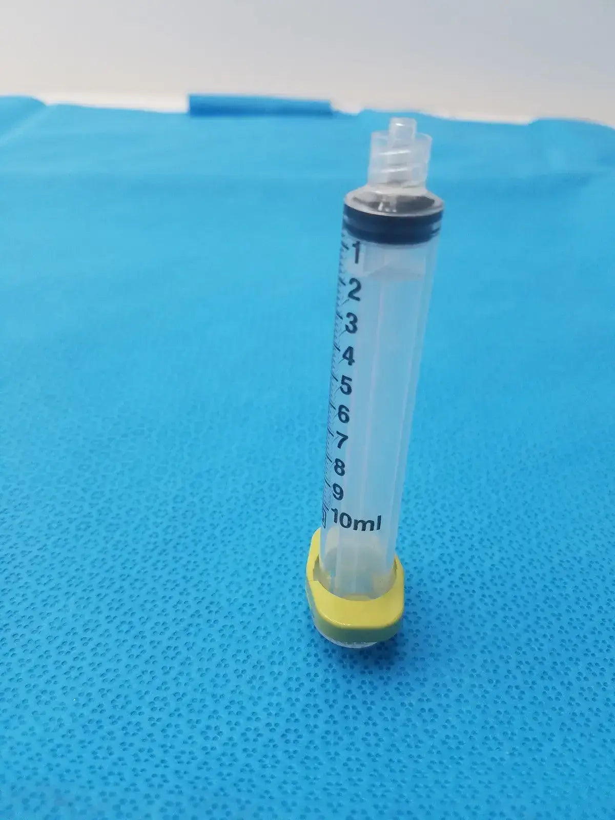 Get a 10ml medical syringe with a yellow clip, a clear barrel, and visible markings for dependable measurement and handling. Buy BD 10ml Syringe at a low price.