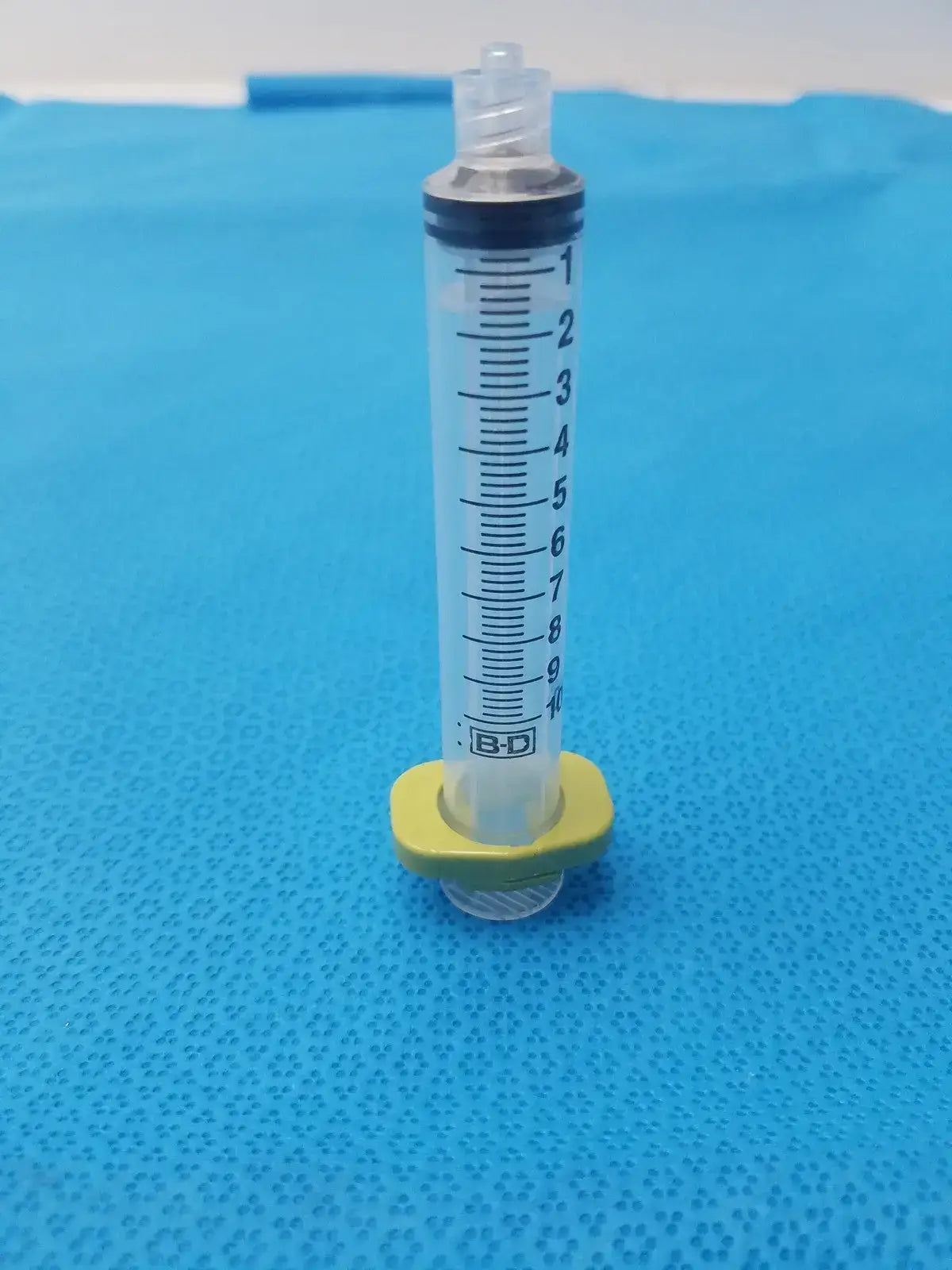 Get a 10ml medical syringe with a yellow clip, a clear barrel, and visible markings for dependable measurement and handling. Buy BD 10ml Syringe at a low price.