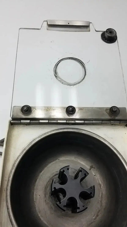 Silver metal beckman microfuge b microcentrifuge with transparent lid and black rotor chamber used medical equipment for sale