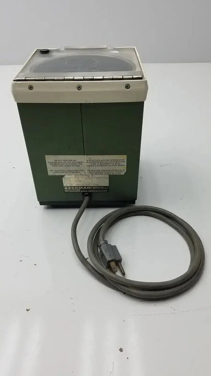 Green beckman model ultrasonic cleaner with clear lid and coiled gray cord for beckman microfuge b microcentrifuge
