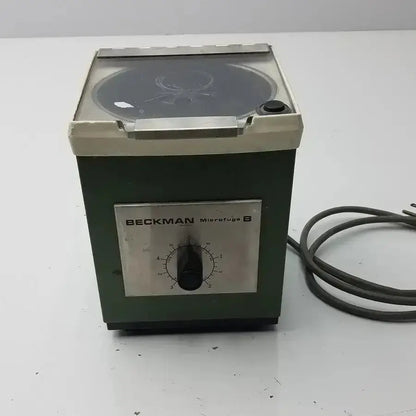Beckman microfuge b microcentrifuge with dark green body silver control panel and glass rotor chamber used medical equipment for sale
