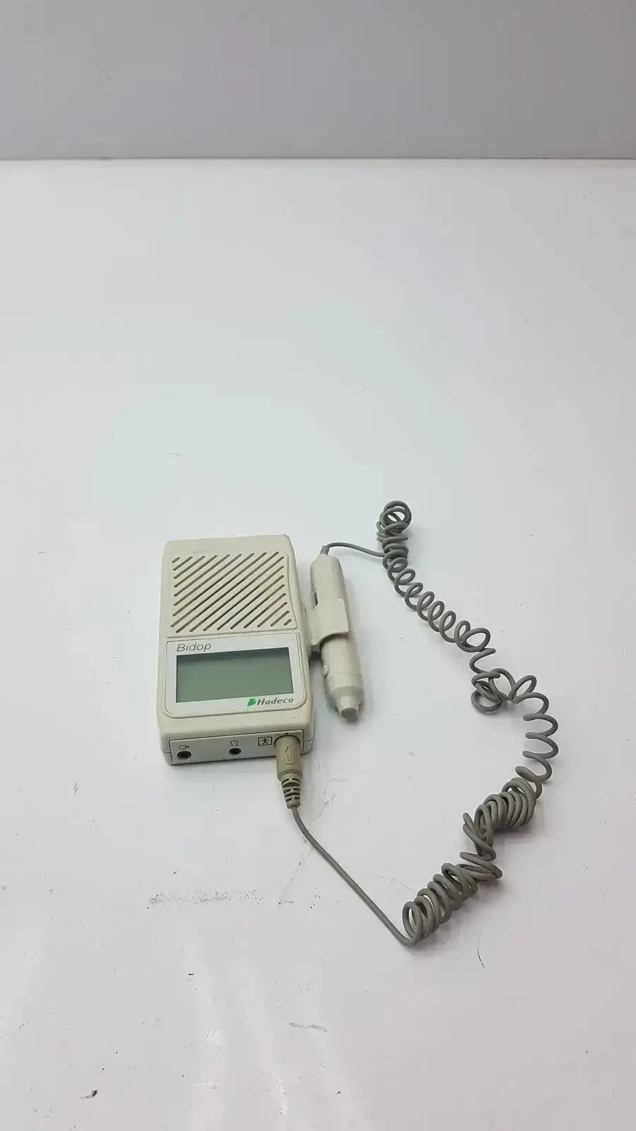 Beige plastic bidop hadeco es-100v3 handheld unit with coiled gray cable and probe bi-directional vascular doppler device