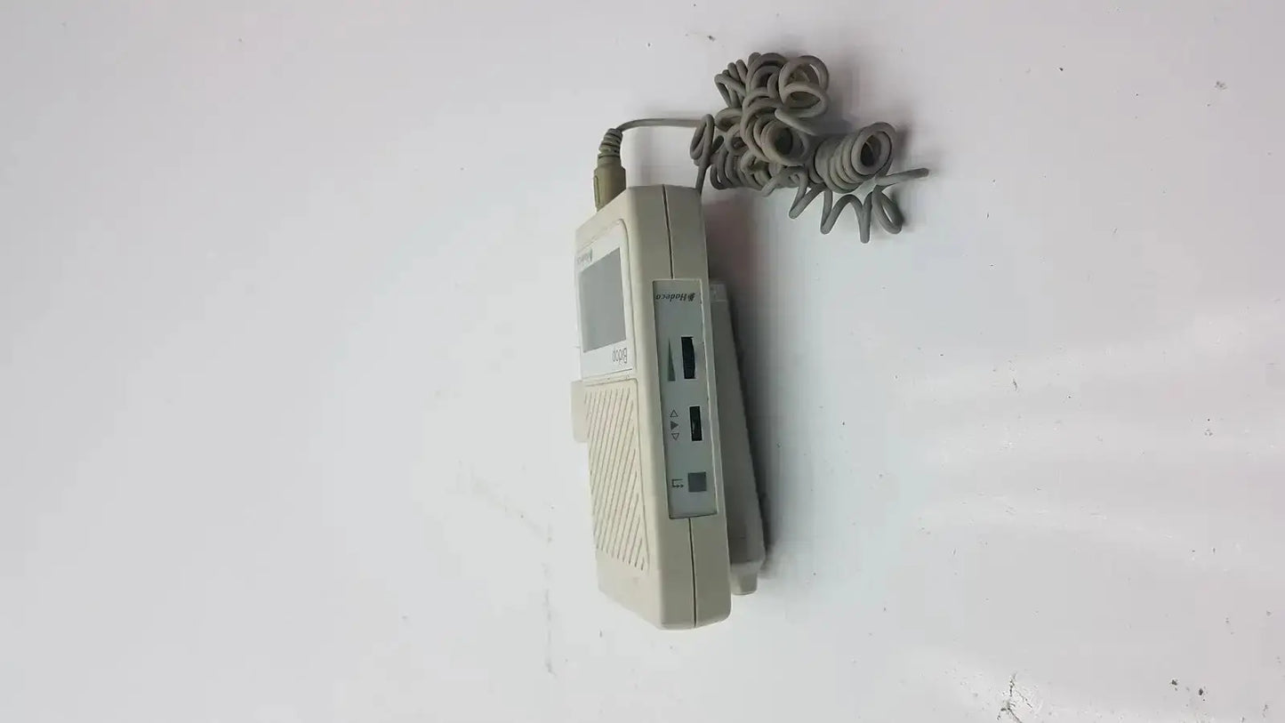 Beige plastic corded telephone with coiled gray cable in bidop hadeco es-100v3 bi-directional vascular doppler handheld unit