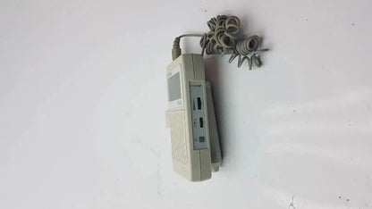 Beige plastic corded telephone with coiled gray cable in bidop hadeco es-100v3 bi-directional vascular doppler handheld unit