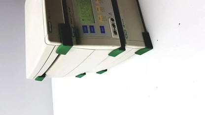 White and green Bio-Rad genepulser xcell electroporation system with digital display and control buttons for precise use
