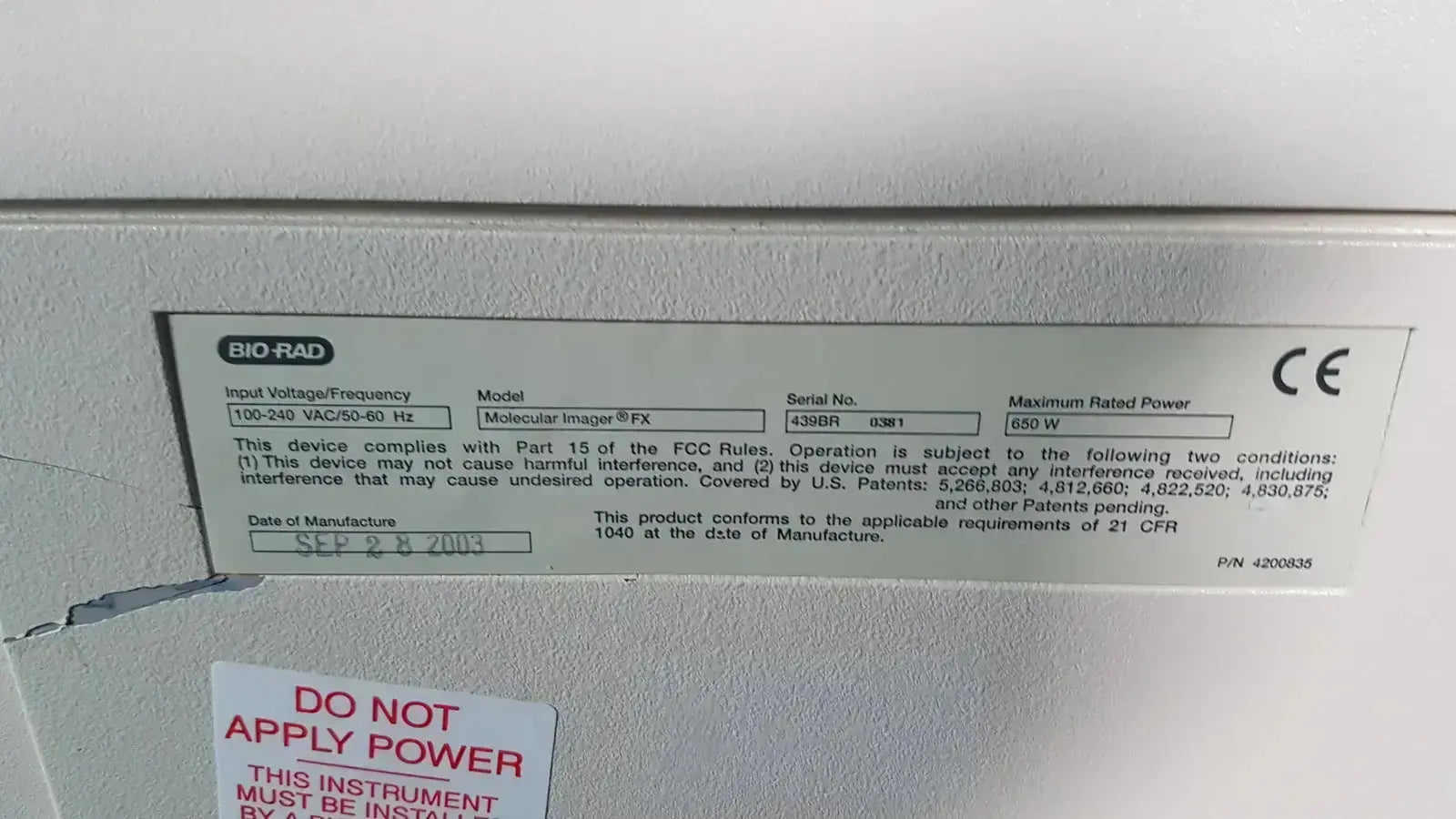 Gray metallic label with black text and ce mark on the back of a bio rad molecular imager fx device showing technical specifications