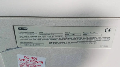 Gray metallic label with black text and ce mark on the back of a bio rad molecular imager fx device showing technical specifications