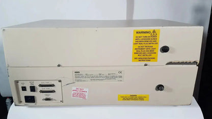 Beige industrial-grade bio rad molecular imager fx with warning label and multiple ports on rear panel of rad molecular imager