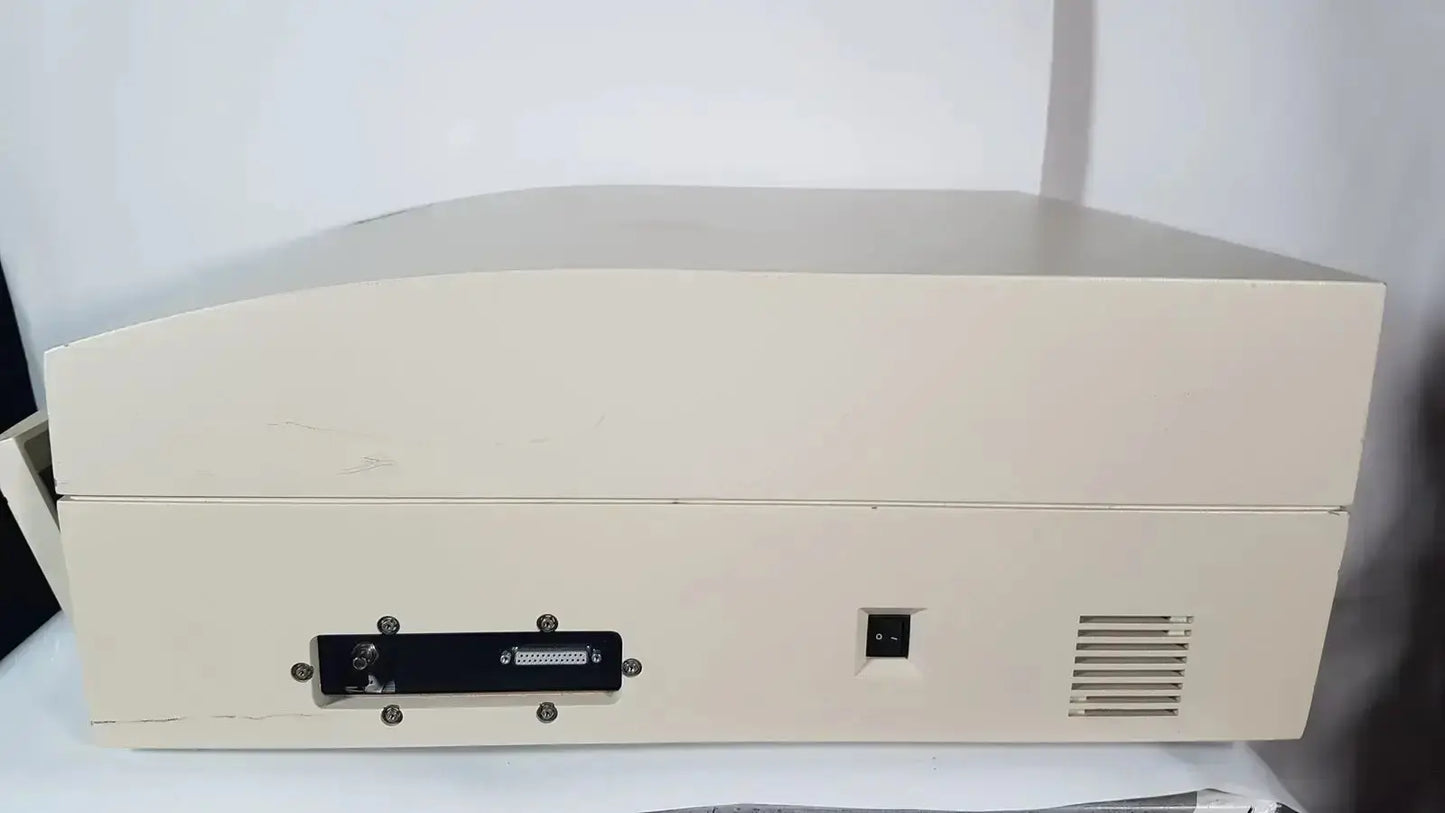 Beige plastic bio rad molecular imager fx desktop computer back with black serial port and power connector