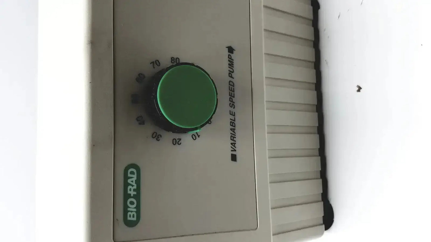 Bio-Rad variable speed pump 260-BR beige plastic speed pump with green dial and black markings for precise control