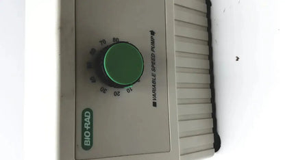 Bio-Rad variable speed pump 260-BR beige plastic speed pump with green dial and black markings for precise control