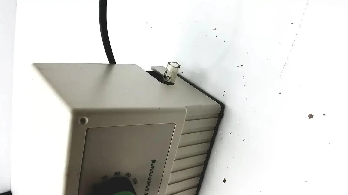 Beige plastic bio-rad variable speed pump 260-br with green dial and black power cord for precise speed control