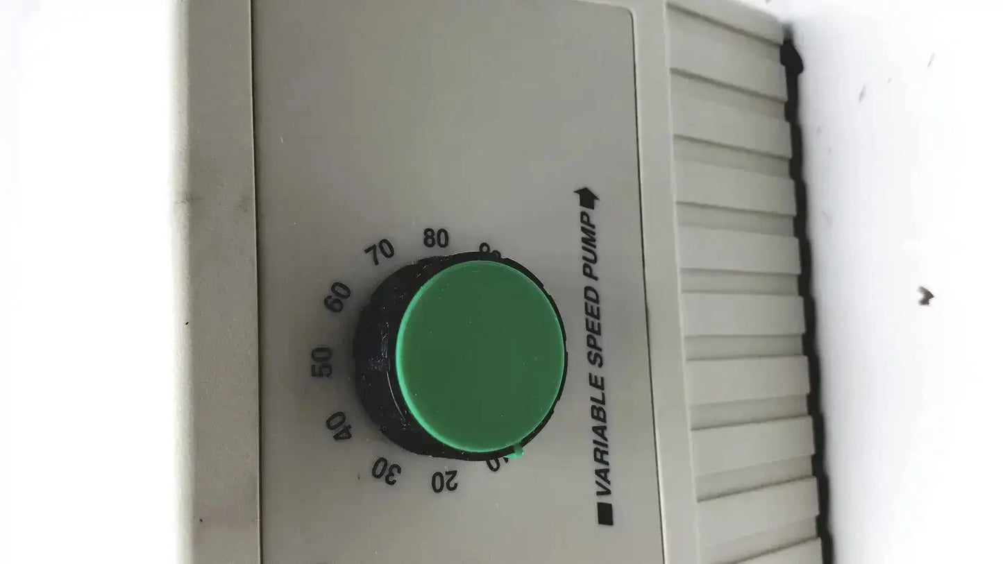 Green circular dial on beige bio-rad variable speed pump 260-br control panel for precise speed pump adjustment