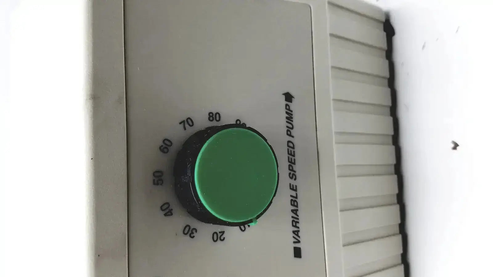 Green circular dial on beige bio-rad variable speed pump 260-br control panel for precise speed pump adjustment