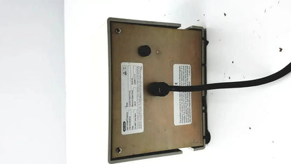 Beige rectangular bio-rad variable speed pump 260-br with black cable and white labels on the back side of the speed pump