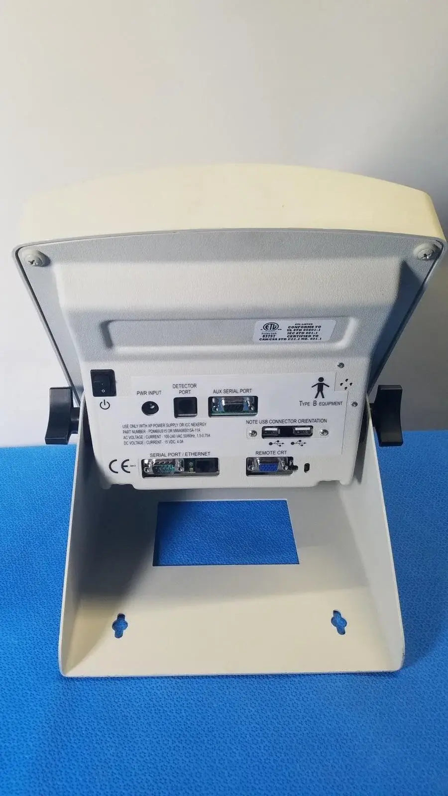 Beige plastic medical equipment back panel of biodex 086-330 atomlab 500 dose calibrator with multiple ports and buttons