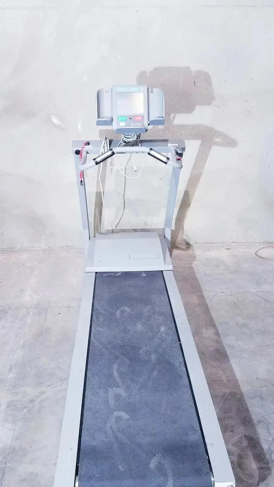 Gray biodex gait trainer ii treadmill with digital display and black running belt for precise gait training sessions
