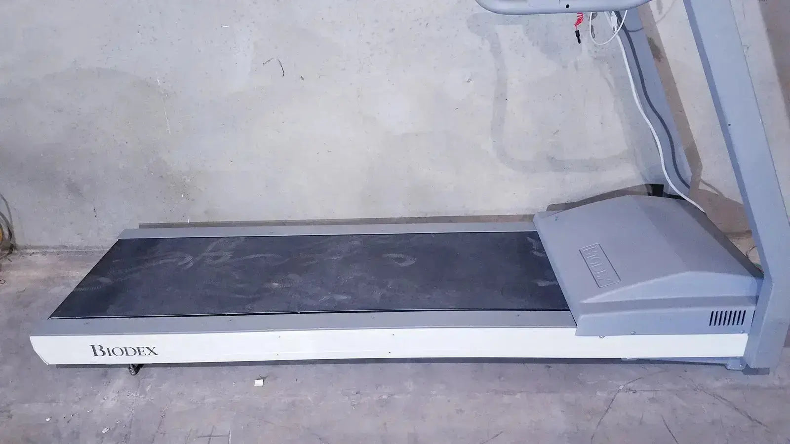 Gray and white biodex gait trainer ii treadmill with a black running belt designed for rehabilitation and gait training