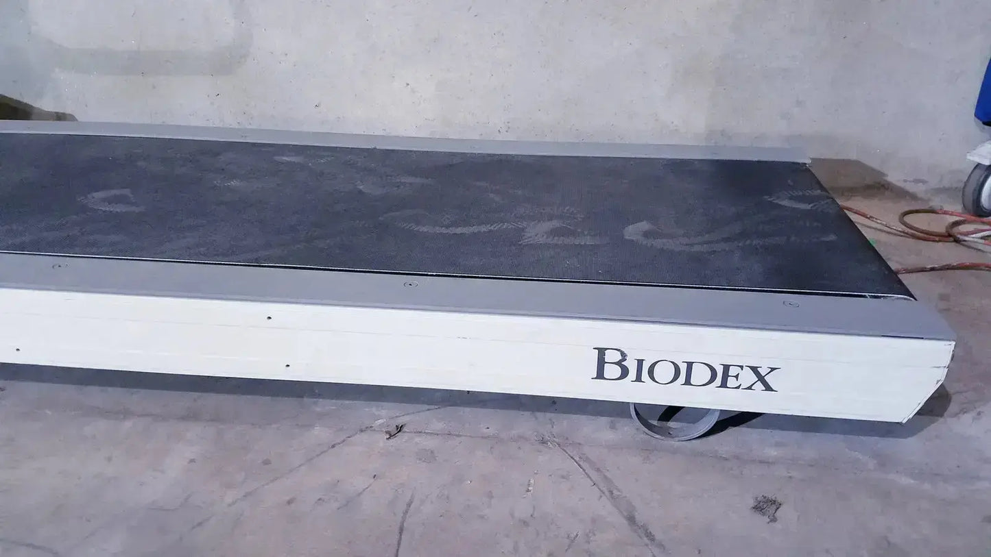 White and black biodex gait trainer ii treadmill platform with a matte finish designed for rehabilitation training