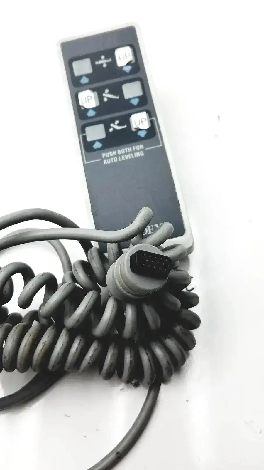 Black biodex ultrasound table remote controller with coiled gray cable and 12-pin connector for ultrasound table use