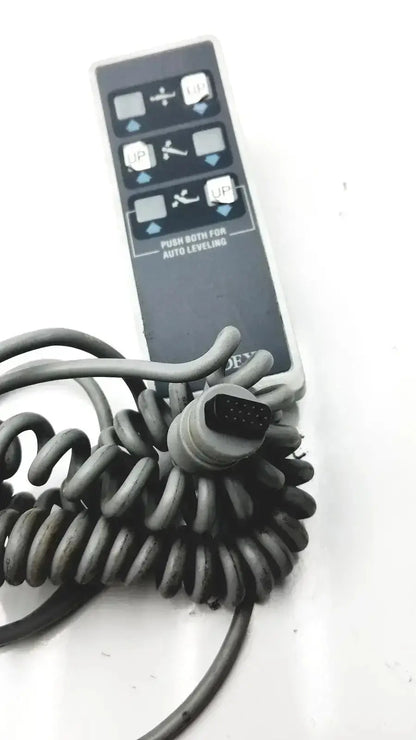 Black biodex ultrasound table remote controller with coiled gray cable and 12-pin connector for ultrasound table use